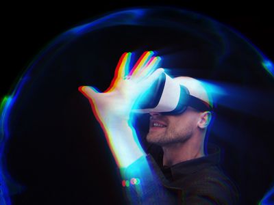 Someone using virtual reality inside a bubble, and reaching out as if to touch something.