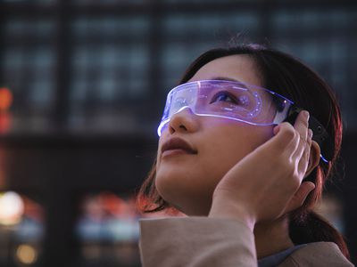 woman using a smart glasses in front of an office building