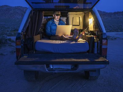 Camper using power inverter to run laptop