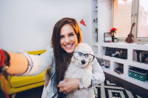 Selfie with cute little dog with eyeglasses