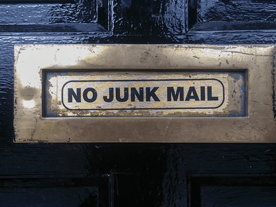 Image of a mail slot with a No Junk Mail label